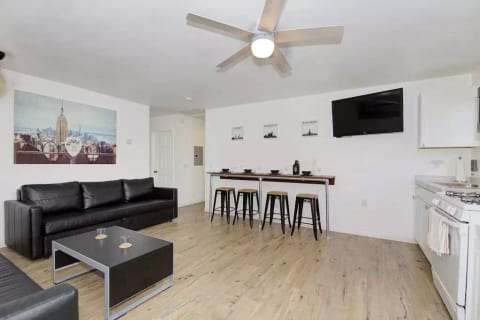 Enjoy drinks and meals at the built-in counter-height bar while catching sports or a movie from the perfect angle on the full-motion, adjustable wall-mounted television complete with popular Roku apps.