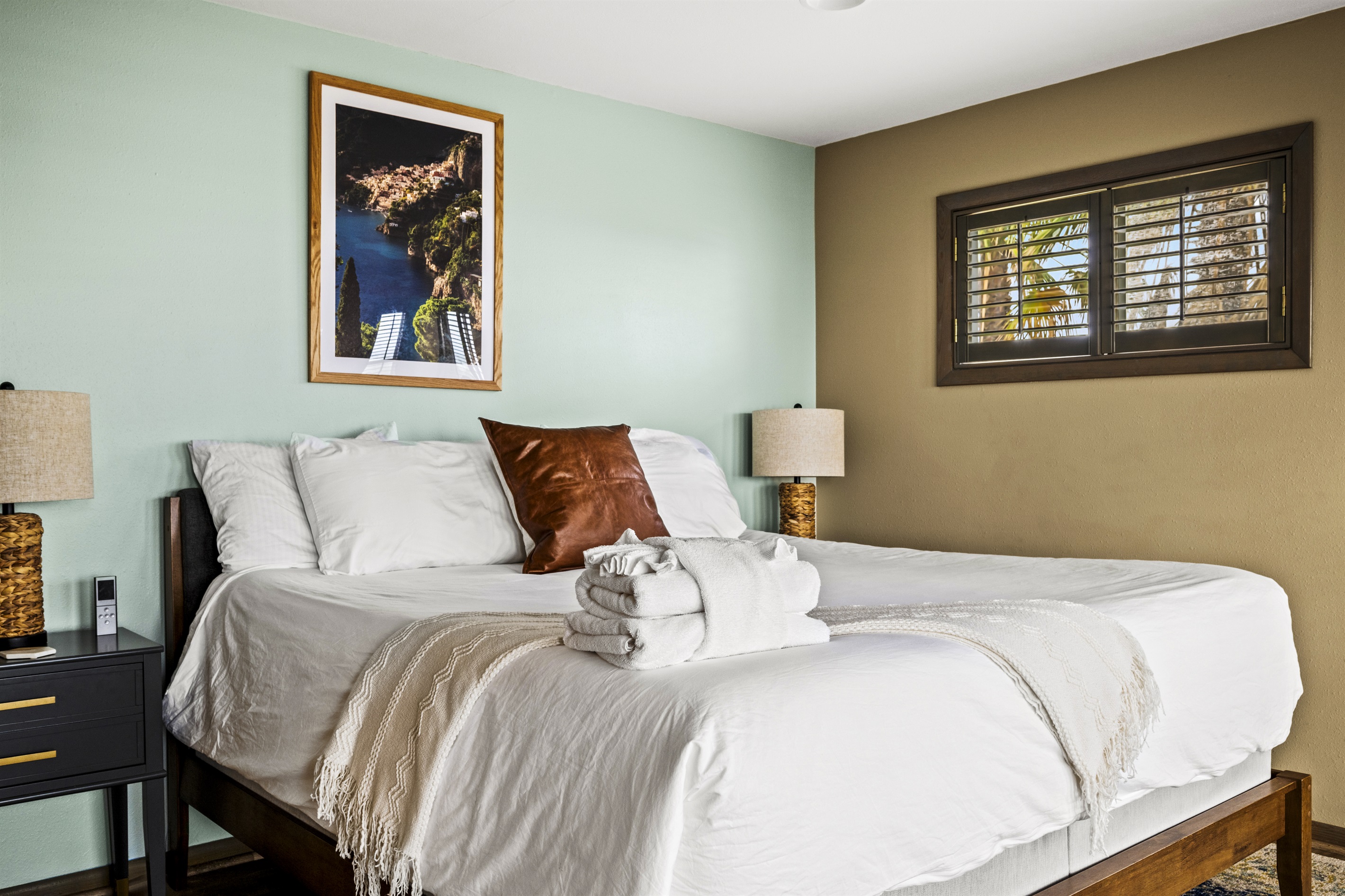 Tropical chic Master bedroom equipped with a comfortable king-size bed and access to a tranquil private veranda. Tropical chic Master bedroom equipped with a comfortable king-size bed and access to a tranquil private veranda. - Family Beachfront Oasis - Eastpoint