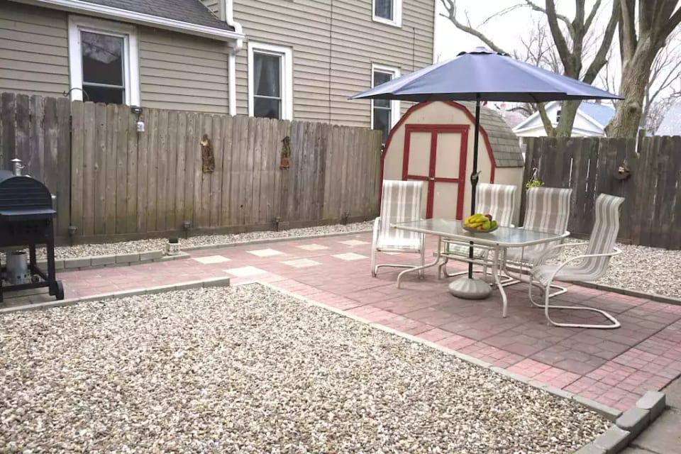 Fenced-in, private backyard with charcoal grill