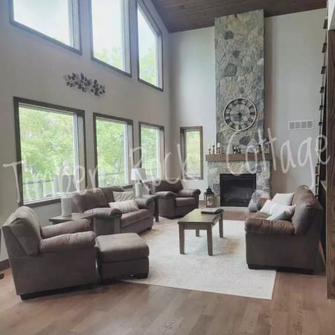 Great room with fireplace overlooking the lake