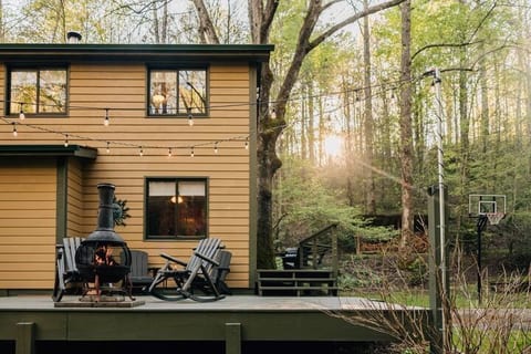 Unwind beneath twinkling lights on the deck at Foxie Moxie, where spacious outdoor areas offer the perfect retreat from the hustle and bustle of everyday life.