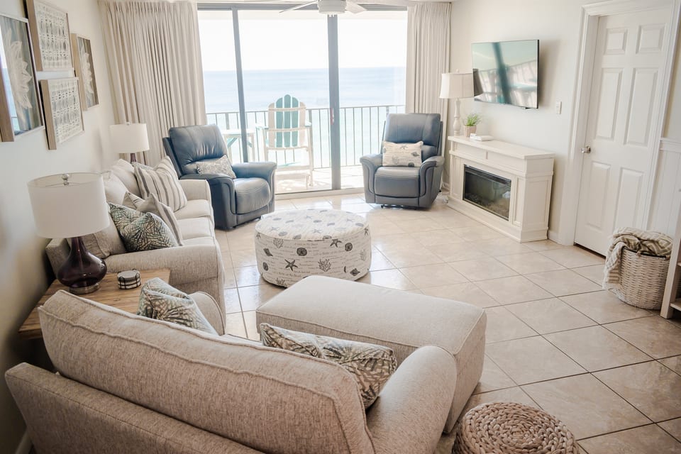 Settle back and relax on comfy living-room seating, including a recliner, and soak in the coastal vibe as you warm yourself by the electric fireplace.