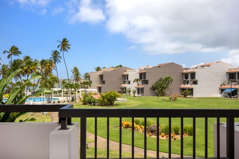First floor outdoor terrace with views of pool area and ocean