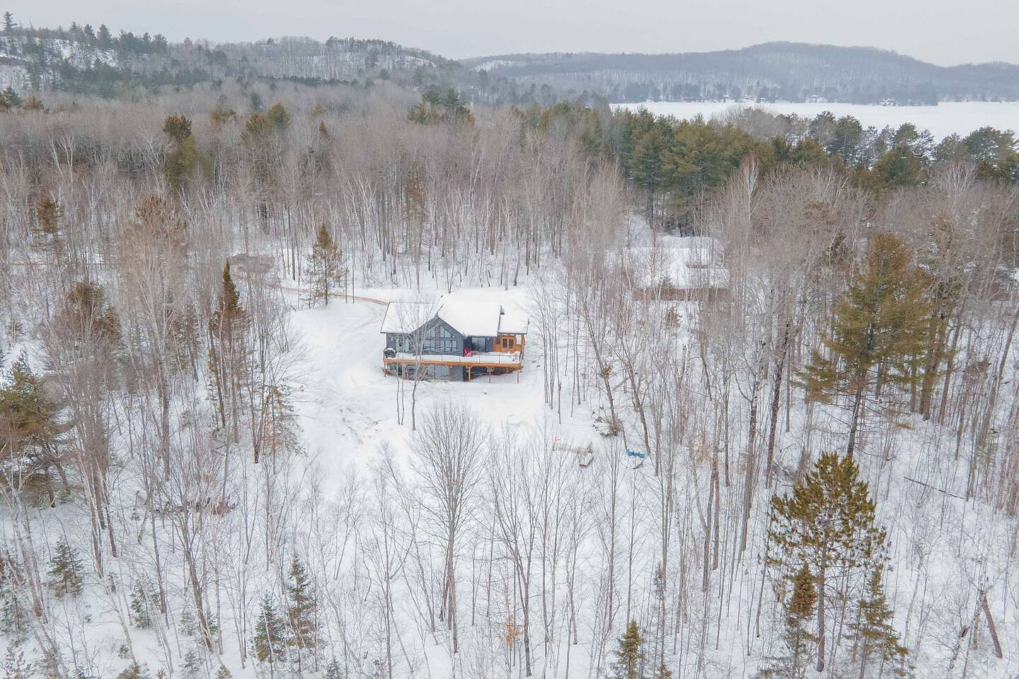 Our Lake Space's one-acre sanctuary, captured in an enchanting aerial view. Enjoy the privacy of the surroundings