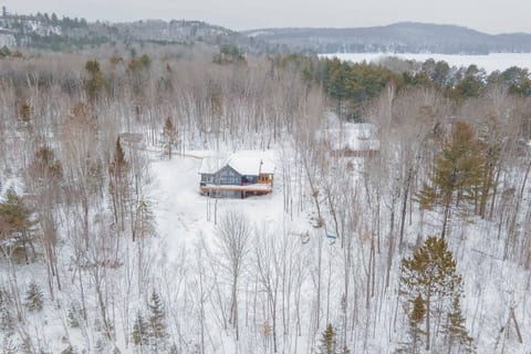 Our Lake Space's one-acre sanctuary, captured in an enchanting aerial view. Enjoy the privacy of the surroundings
