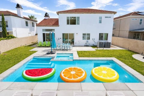 Resort like backyard that is fully fenced, and private. The house has a private pool, spa that can be heated as an add on. Full entertainment with a bbq and fire pit. You never have to leave the property!