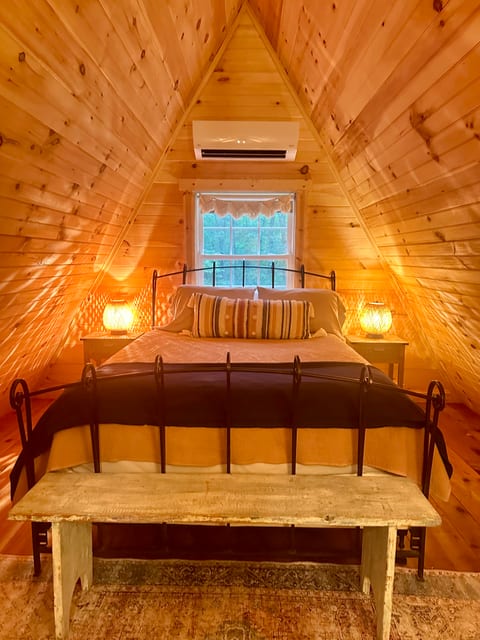 This bedroom is located at the top of the staircase to the right and overlooks the back yard.