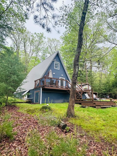 A view of the back of Angled Pine. A large upper deck allows for dining, lounging and cooking on the Blackstone griddle. The lower deck is suitable for reading and sunbathing.