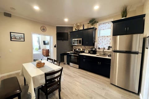 Beautiful kitchen with a flatscreen TV on wall