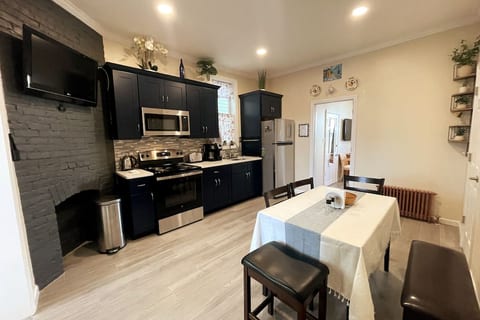 Beautiful kitchen with a flatscreen TV on wall
