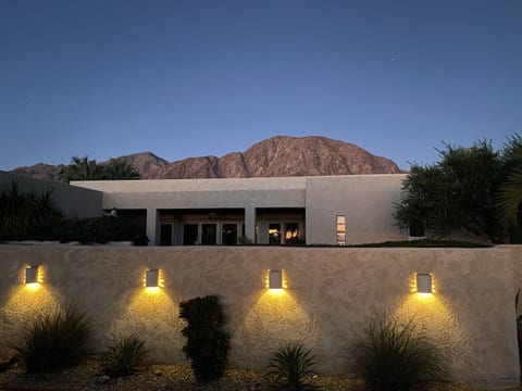 This is a place where you can imagine yourself enjoying the serene desert environment, with the mountains as a stunning backdrop