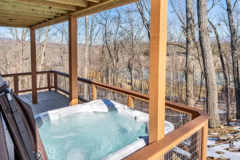 Enjoy the hot tub and a view of the woods