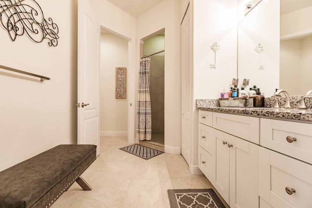 Master Bathroom with standing shower and private toilet room.