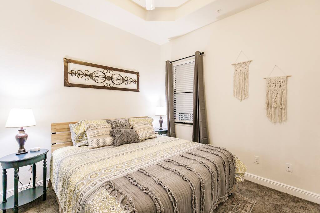  King Suite 3 features a comfortable king-sized bed, a bureau, a closet, and a smart television.