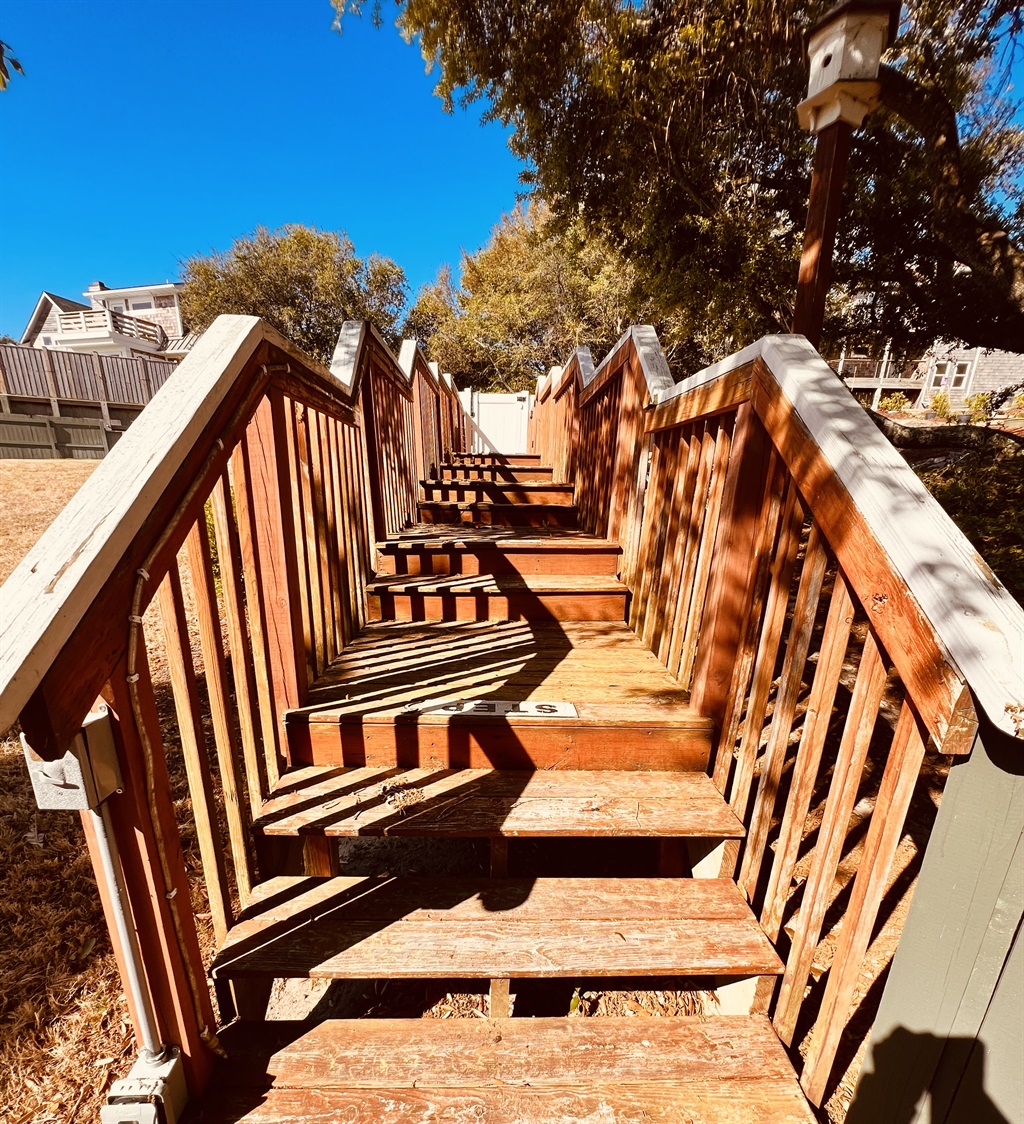 walking path to gated private pool backyard
