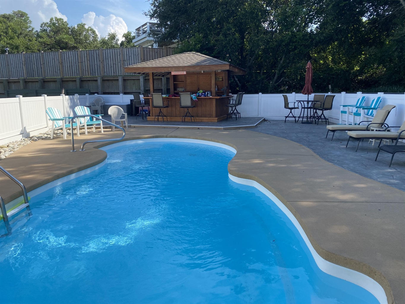 Fenced pool and tiki bar