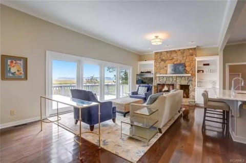 Living area overlooking the river - we have added a 75' TV