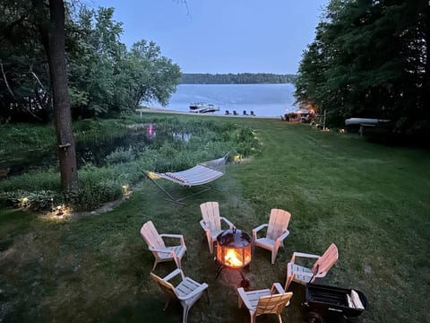 No matter the season, experience a quiet, peaceful retreat from everyday life. 200 feet of sandy shoreline and a 2 acre wooded lot - guests rave about the private setting.