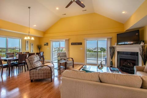 living room with views off 3rd floor deck