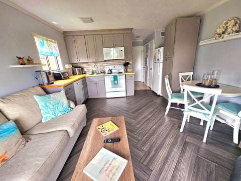 An extra window and large sliders make for a bright sun filled living area.