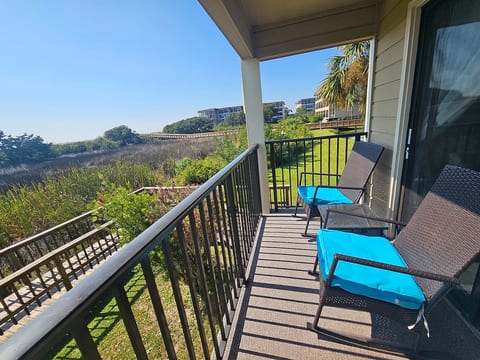 Grab a book and relax in the comfortable rockers. Or simple sit and breath in the Ocean air while enjoying the view of Ocean in the background or the birds playing in the seagrass directly in front of your balcony!