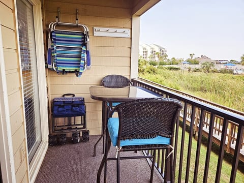 Enjoy the balcony view from the comfortable rockers or high top chairs.  Beach chairs and beach cart are on balcony for you to enjoy while cooler and kid toys can be found inside!