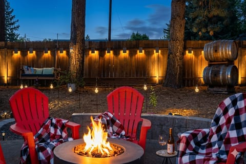 Firepit • Landscape lighting • Wine barrels from Domaine Serene • Warm Blankets • Small white lights lace the firepit area
