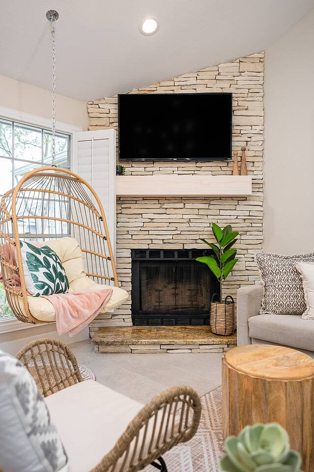 Relax in front of the fireplace or sway on the swing with a show on