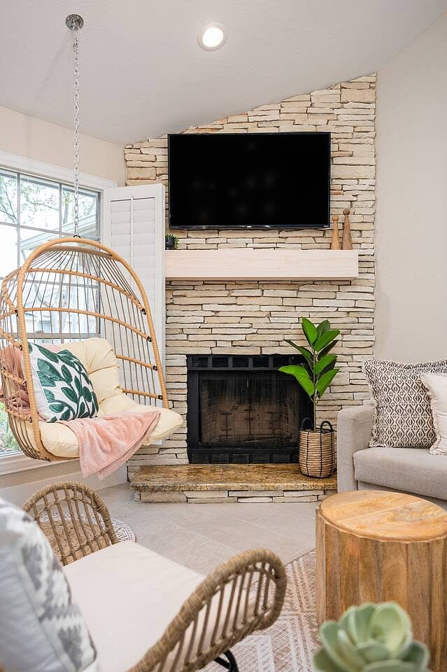 Relax in front of the fireplace or sway on the swing with a show on