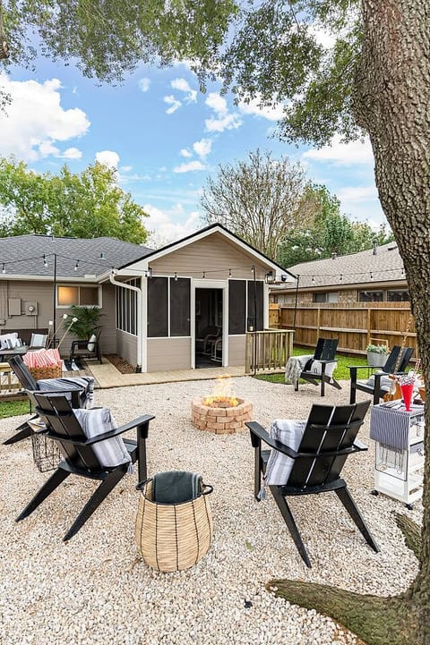 Soak in the ambiance of outdoor seating, a warm fire, and flourishing greenery
