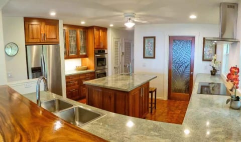 High end itchen with Sapele mahogany cabinets, granite counters, breakfast bar