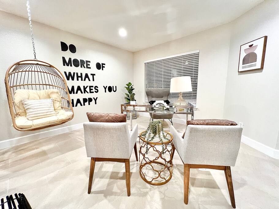 A perfect blend of relaxation and productivity—modern chairs, a swing for unwinding, and a work space to stay focused - 4BR Family Oasis | Prime Location, Fast Wi-Fi-TCF - Converse