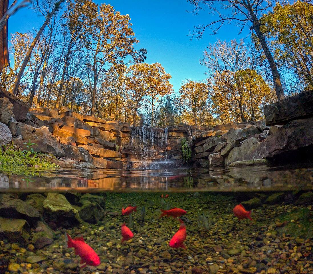 Can a cabin in Broken Bow with a waterfall like this really exist? Yes! And one of our guests, Angela was nice enough to prove it by sharing this pic! Listen to the sound of this waterfall. Feed the fish. It’s your own oasis at Restoration Falls. 