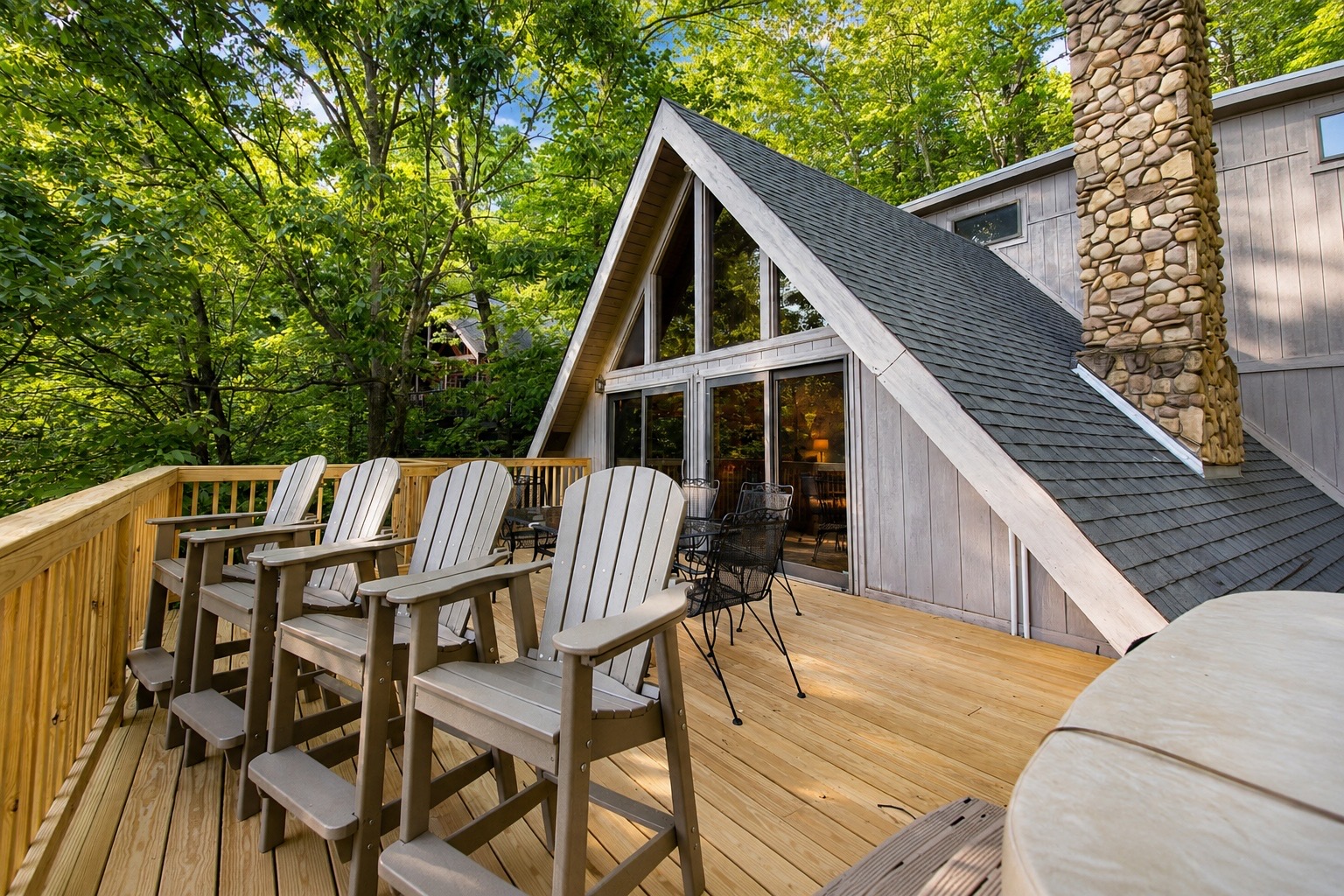 Large deck with hot tub and seating