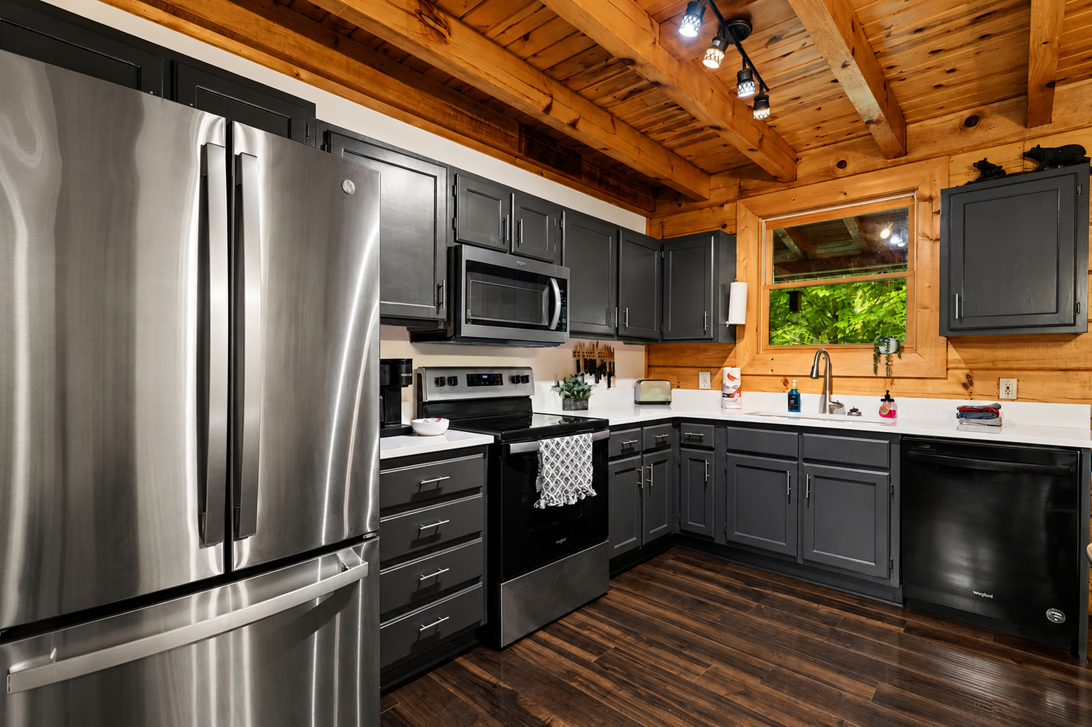 The fully equipped kitchen features plenty of counter space for preparing everything from quick breakfasts to family meals during your Smoky Mountain stay.