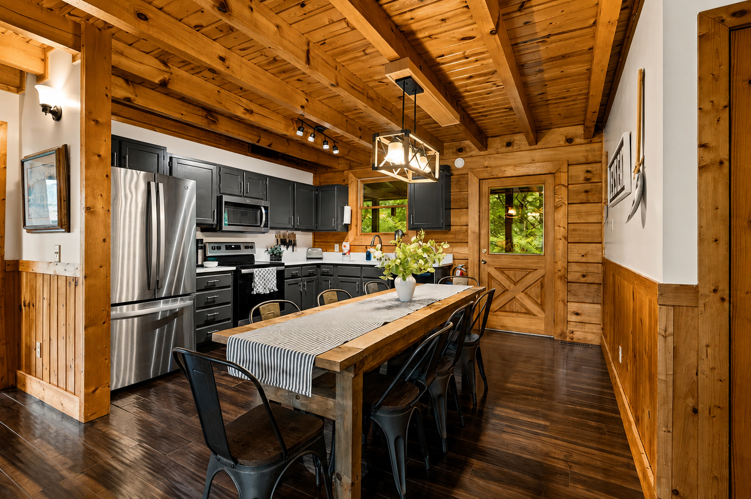 Gather around the large dining table for family meals and conversation, with a fully equipped kitchen just steps away.