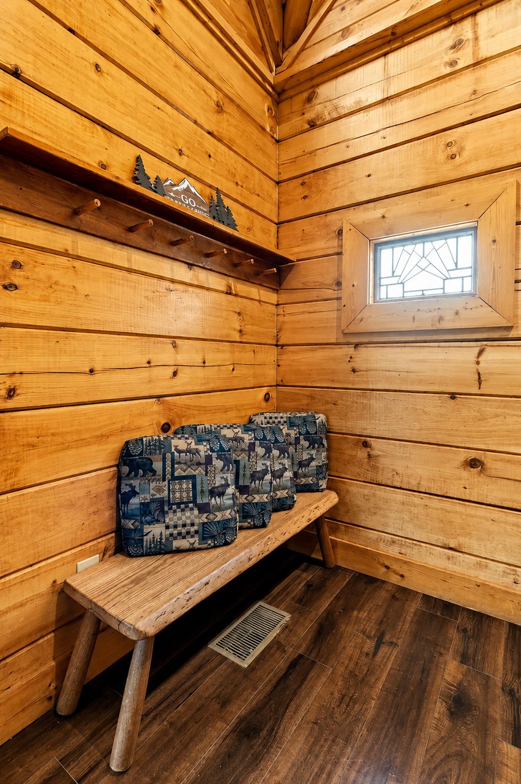 Thoughtful touches make every space feel welcoming, with a convenient spot to hang jackets and sit while getting ready for the day.