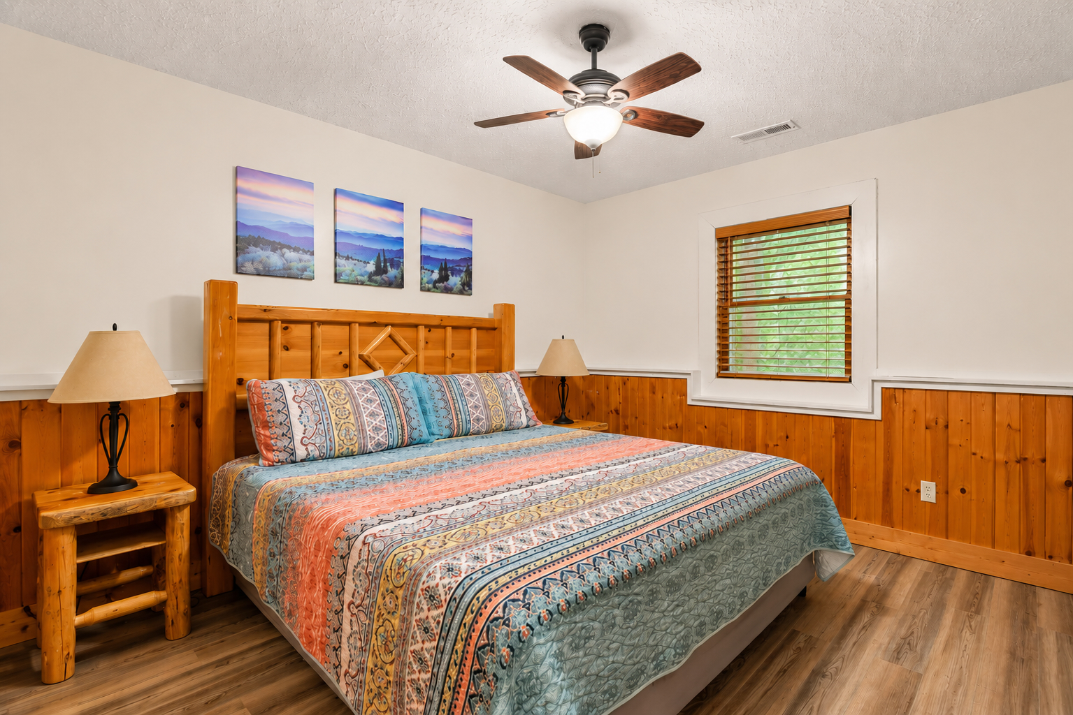 Unwind in a spacious lower-level king bedroom overlooking the peaceful wooded setting.