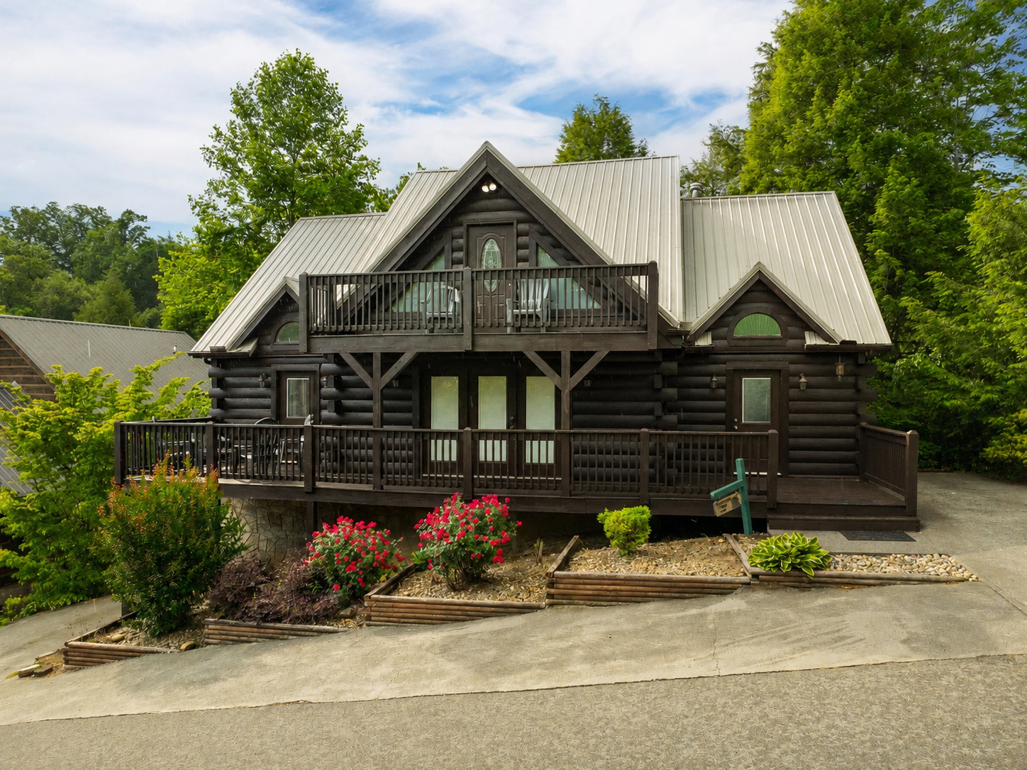 Street view of the cabin with parking on both sides and in front