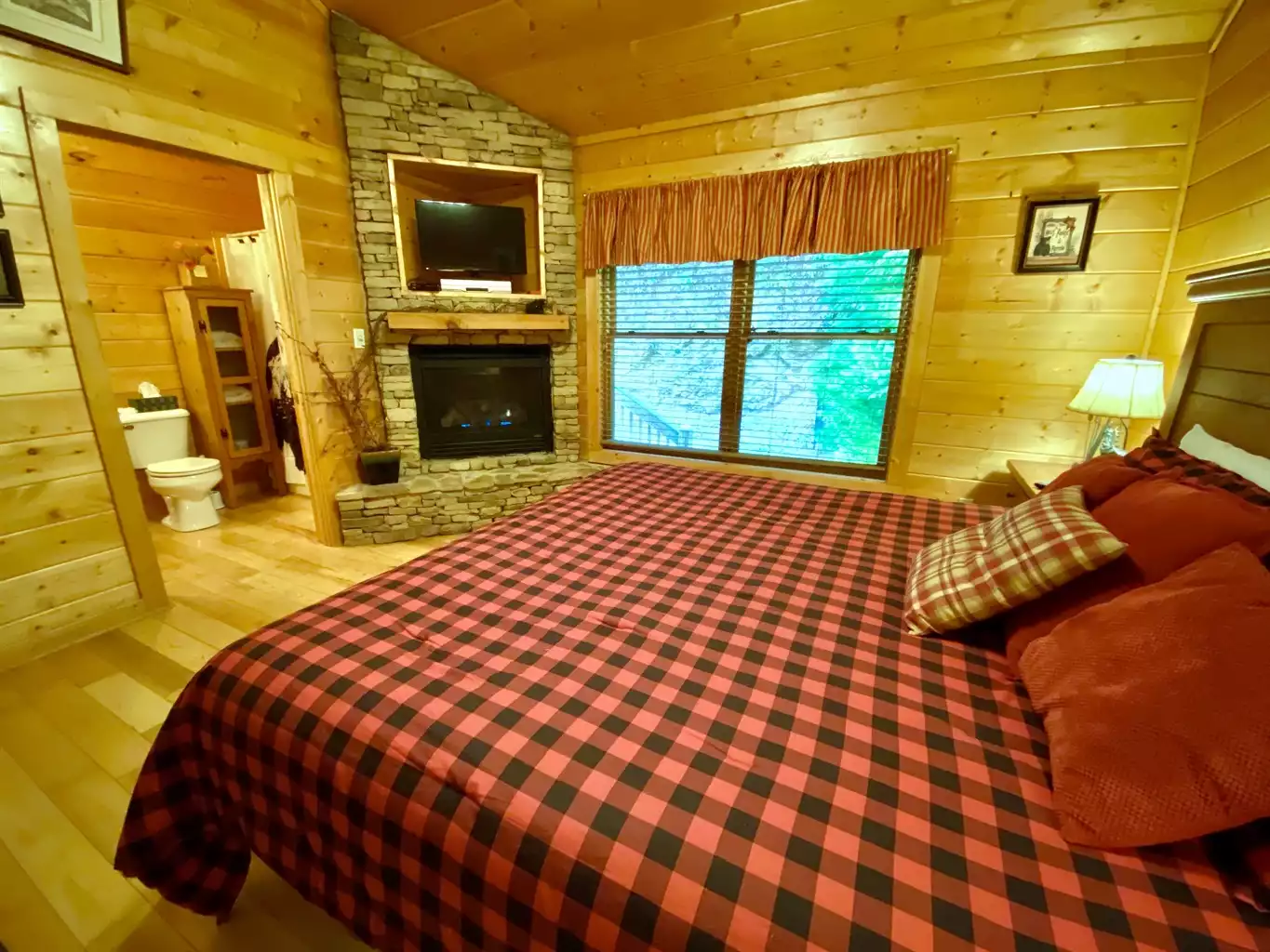 Master bedroom with king bed, TV, and fireplace Master bedroom with king bed, TV, and fireplace - Mountain Air 1BR - Sevierville