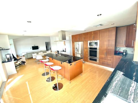 Professional Kitchen with gas cooktop, Miele convection oven & warming drawer, GE convection/micro combo, Nespresso & brew coffee station, blender, waffle iron, reverse osmosis water, and all necessities to make your stay a culinary delight!