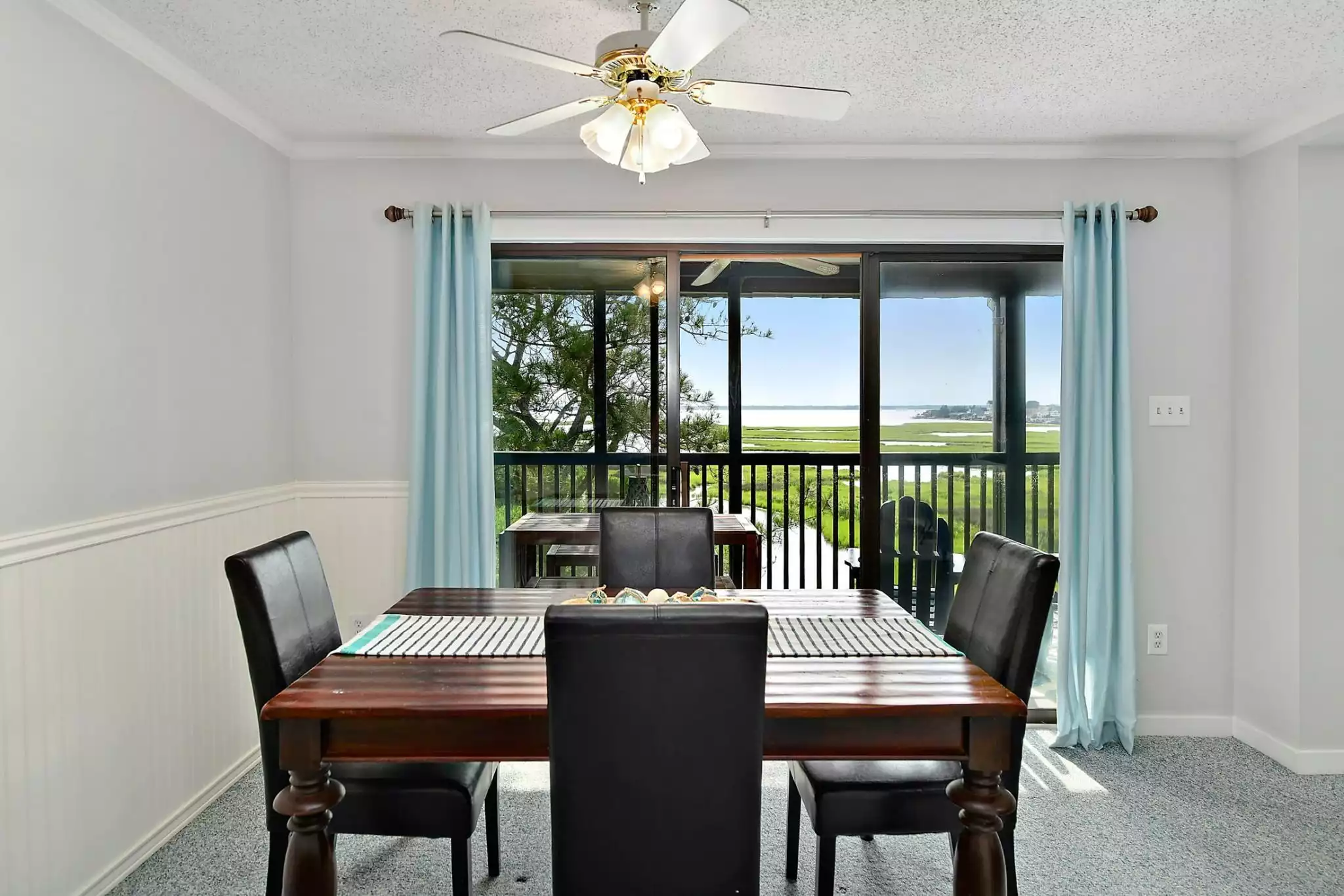 Dining table w/ balcony view - Crooked Crab Condo - Ocean City