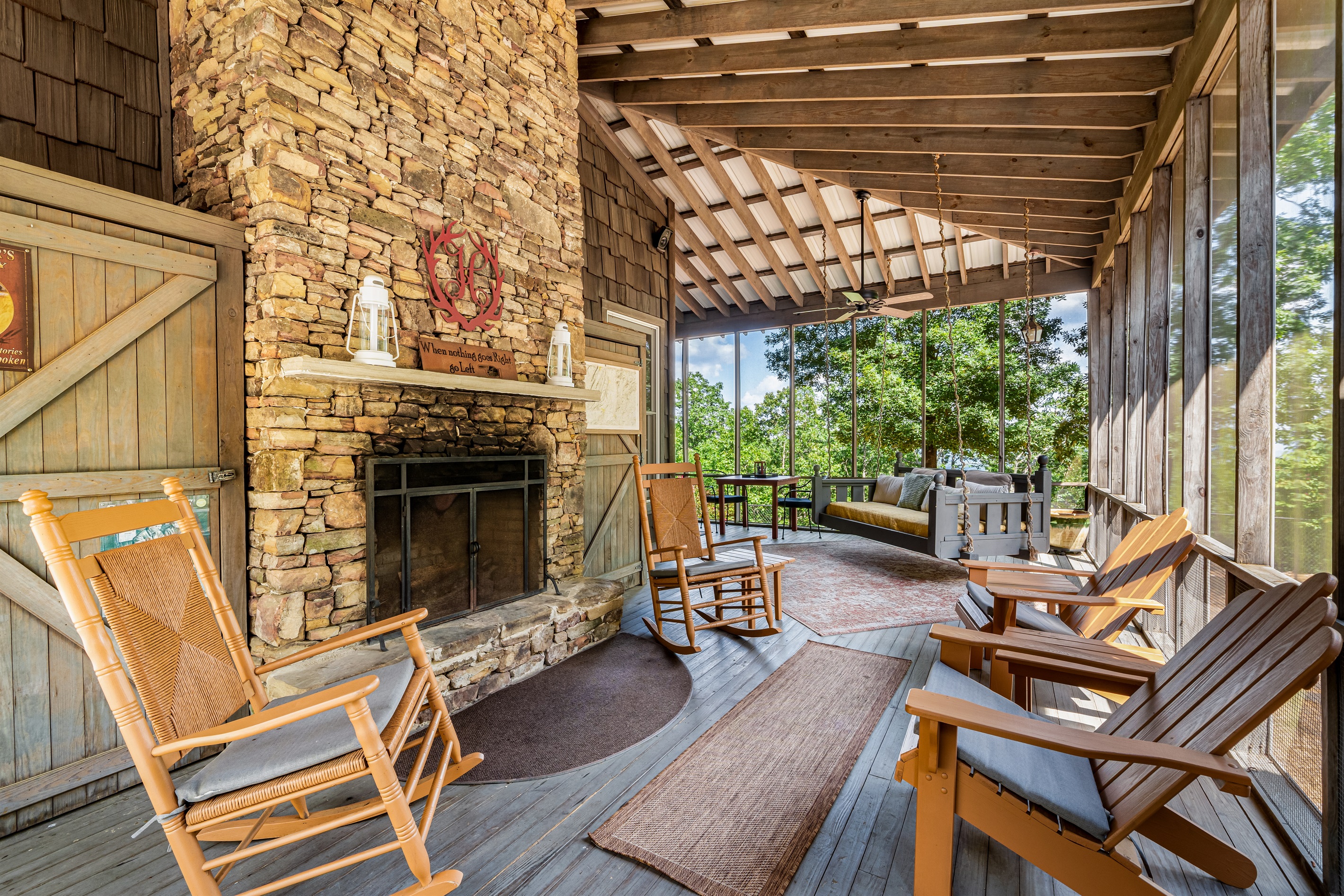 Guest favorite is a large screened porch with large swing bed and fireplace.