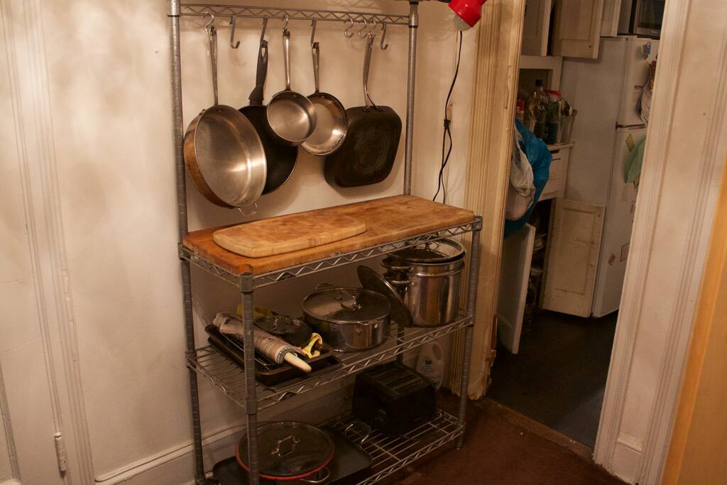 Cutting board and pots/pans rack. - UWS Bedroom In Luxury Building - New York