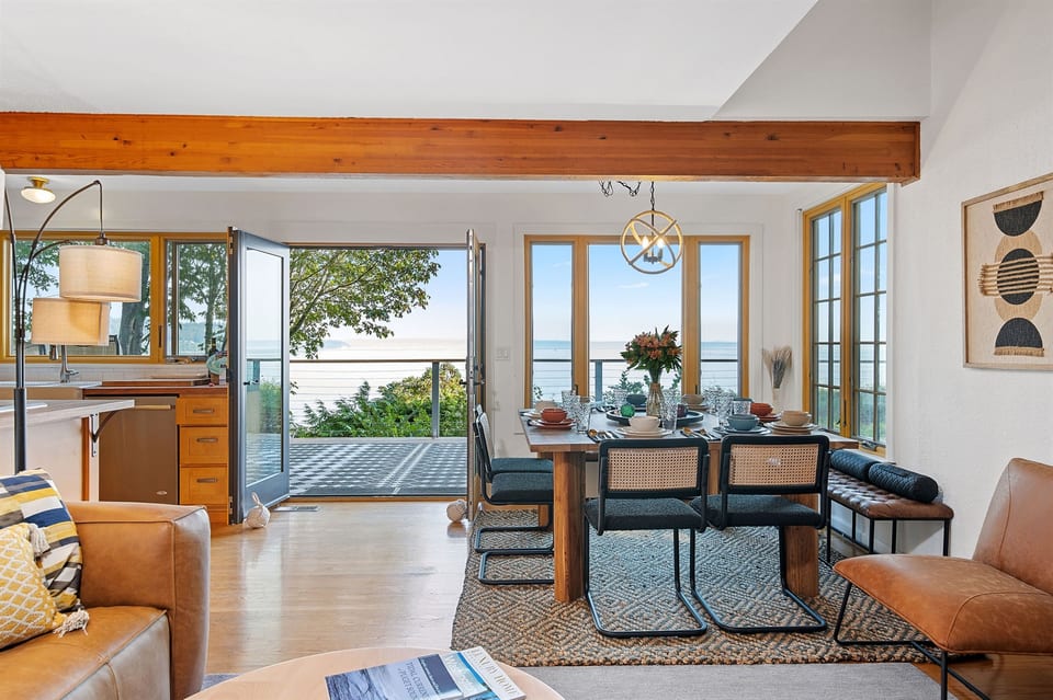 Open commons areas with large windows and double patio doors feel like you're apart of the Puget