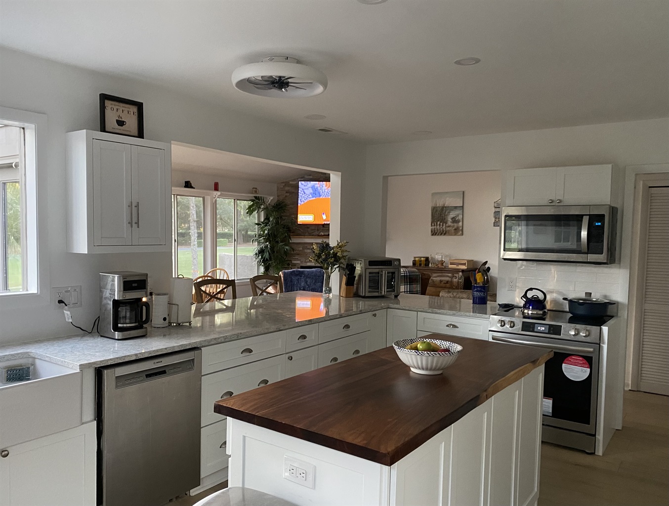 View from kitchen into open DR/FR/LR area 