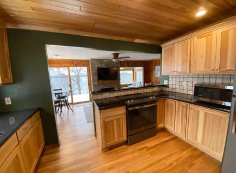 The fully stocked kitchen features granite counter tops and a spice rack to make your homemade meals with a view!