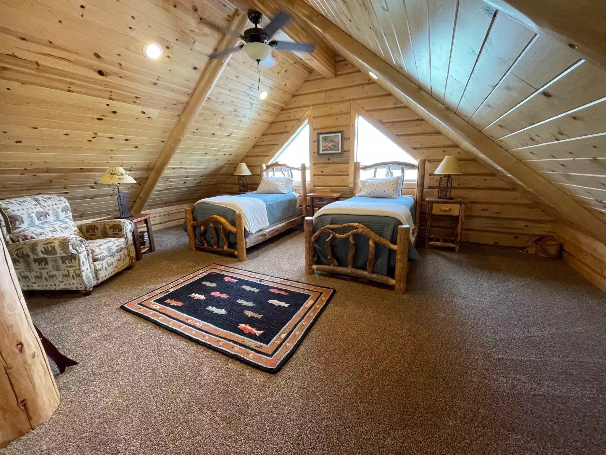 Bedroom #5 loft with two twin beds, recliners seating, open to below. - The Caddis Shack - West Yellowstone