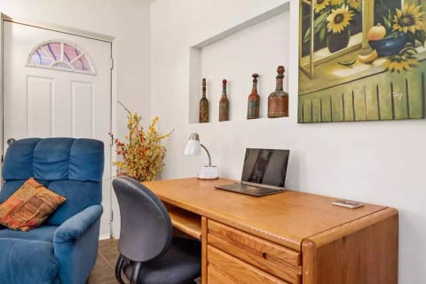 A large, well-lit desk with super-fast wifi, plenty of outlets, a $400 chair that adjusts on multiple planes, and drawers and a keyboard tray. Set up specifically for those working from home.