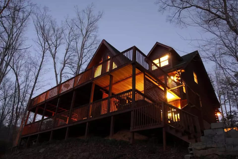 The warmth of spacious Laurelwood on a cold Winter's night.  The hot tub is located on the bottom deck in the right hand corner.